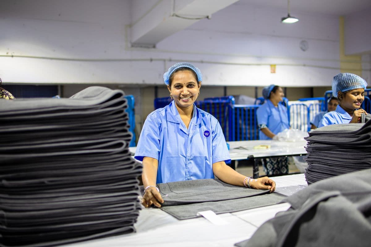 SafaiKart team at work on freshly cleaned laundry